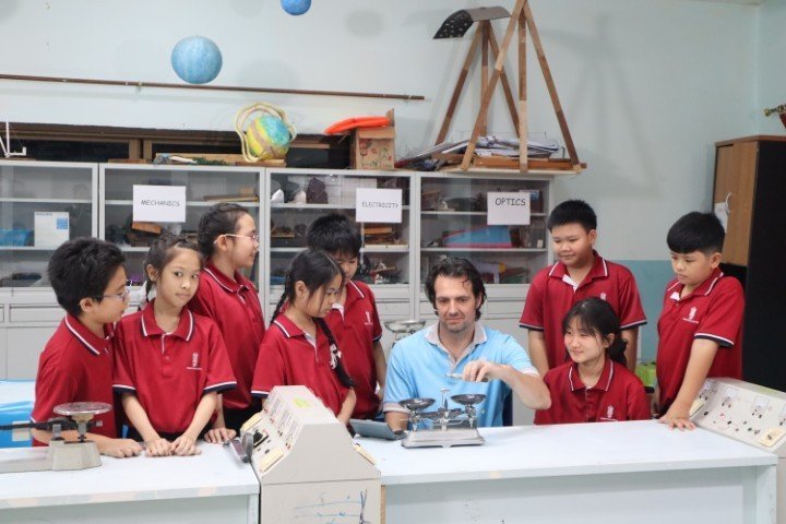 Wichai Wittaya primary students learning science with their teacher